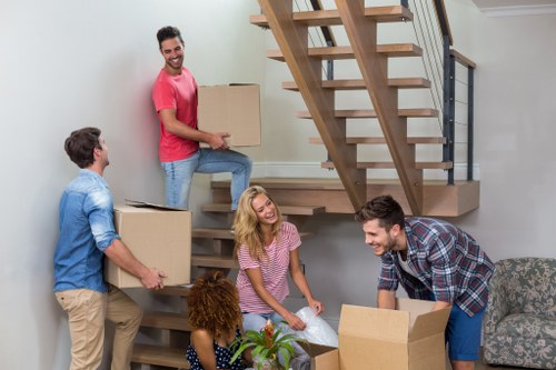 A local removals team handling furniture in Brixton