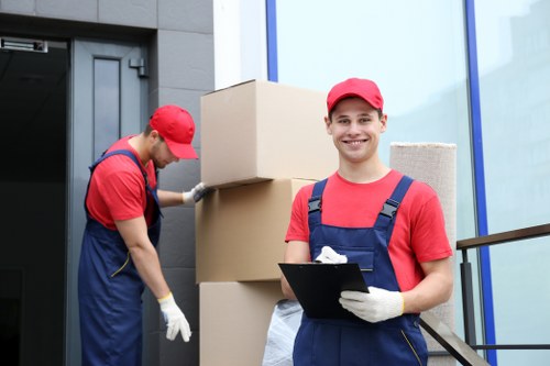 Removal van and moving crew in a Brixton residential street