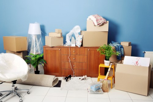 Removal van and moving team in a Brixton residential street