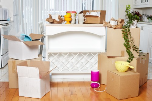 Mover handling belongings carefully in a Brixton home
