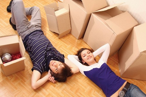 Professional movers handling furniture in a Brixton flat
